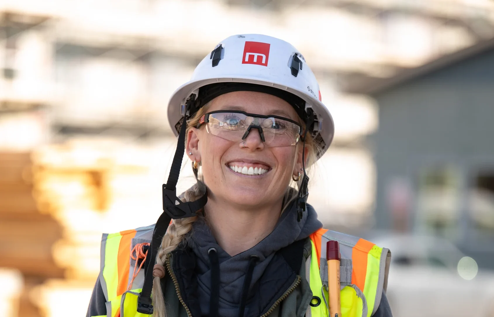 photo of a woman in construction in branded metcalf hat
